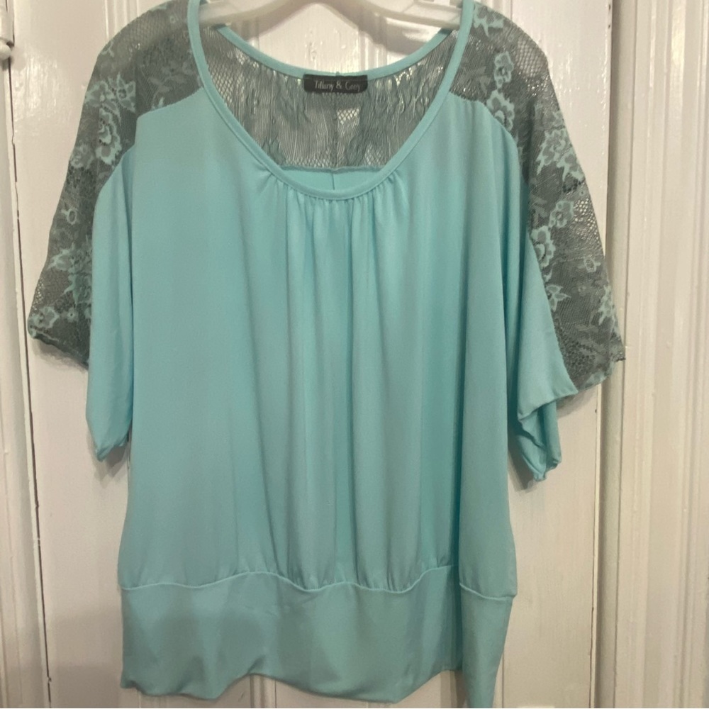 2x aqua colored top with lace accent